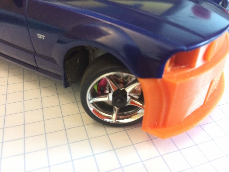 Close up view of front wheel arch with wheels turned in